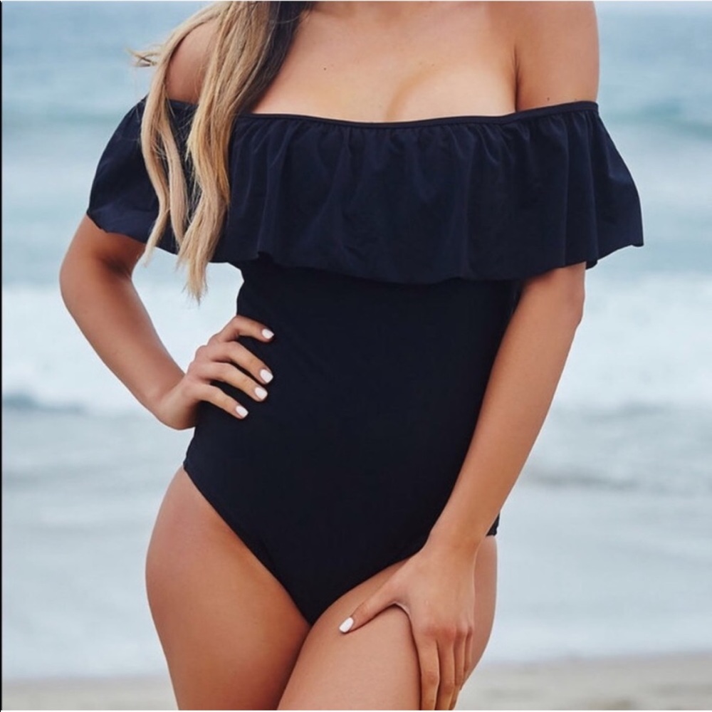 Black one piece swimsuit from Victoria’s Secret.